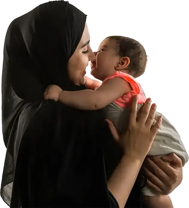 a portrait of a Saudi Arabian Mother holding her infant son